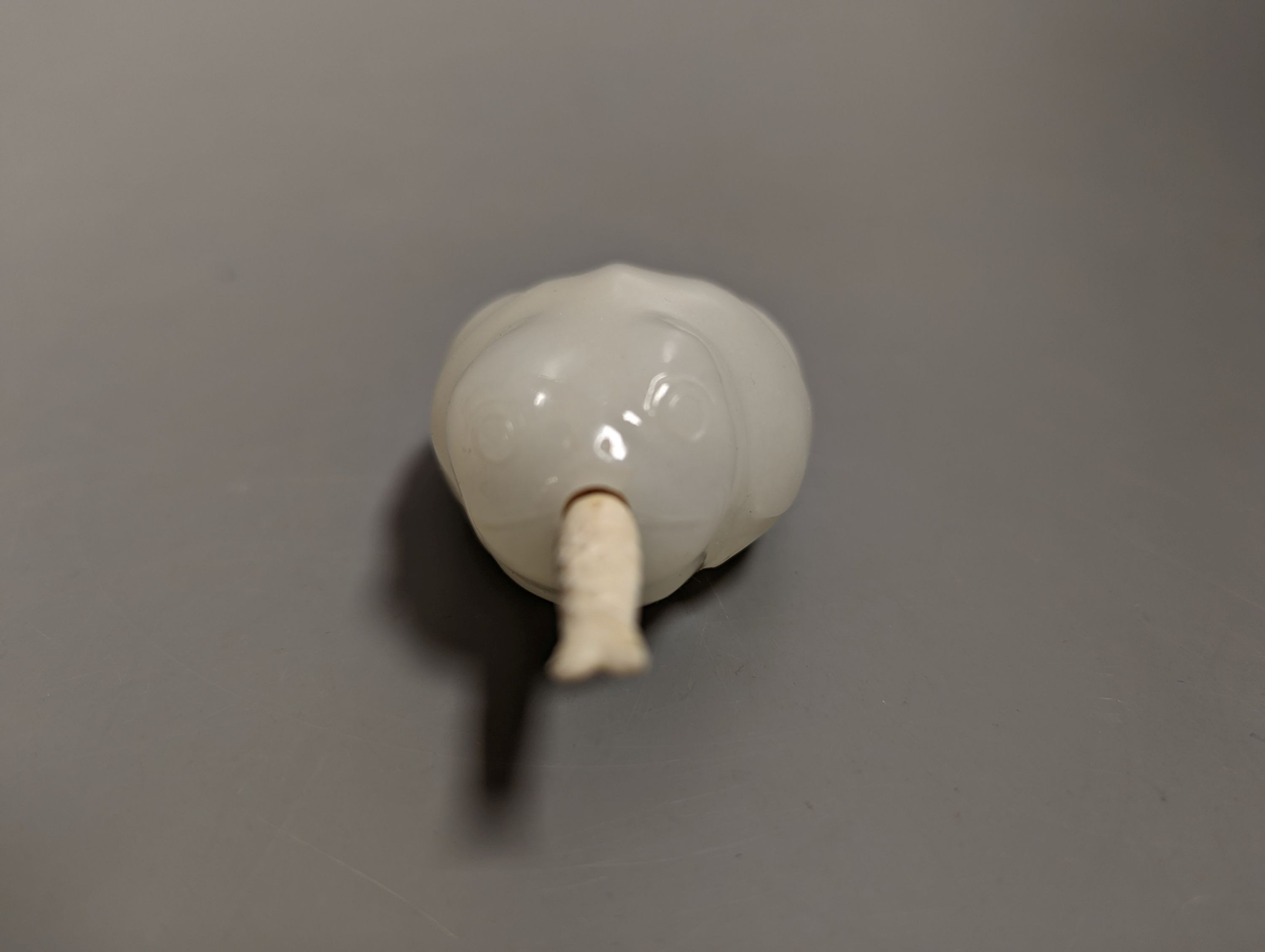 A Chinese white jade 'toad' snuff bottle, the stone of excellent even tone, 8cms long, including stopper